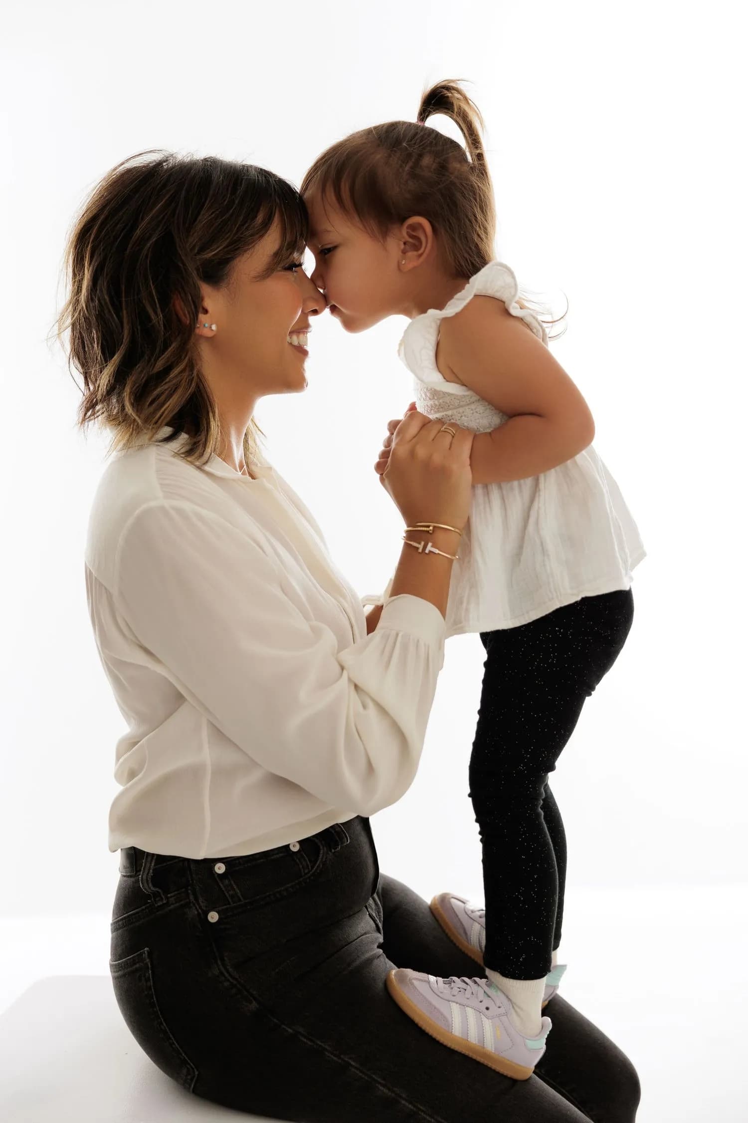 A mother and her child photographed together at the end of a maternity session