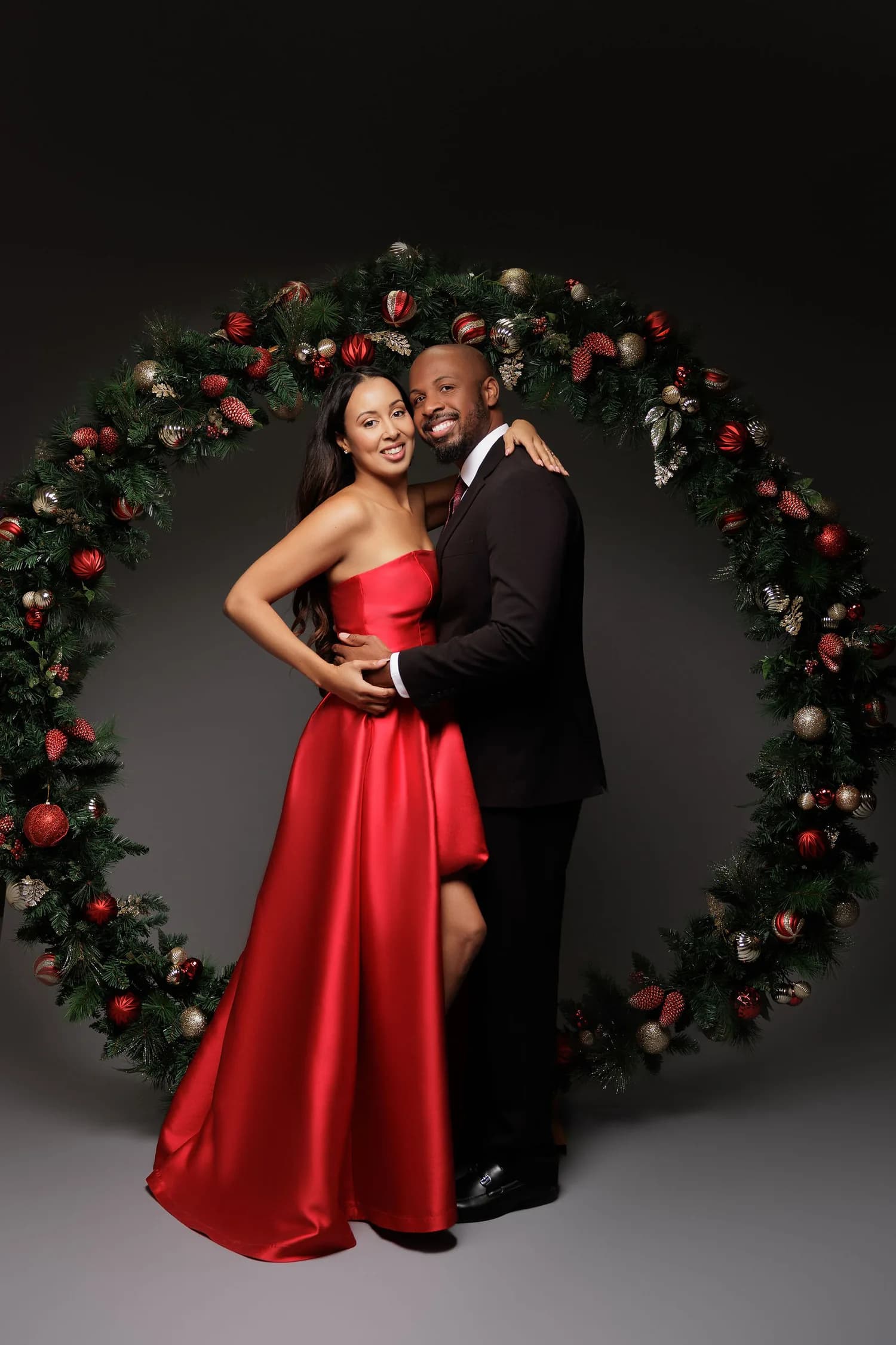 A couple photographed at a Christmas session at Natalie Vell Studio